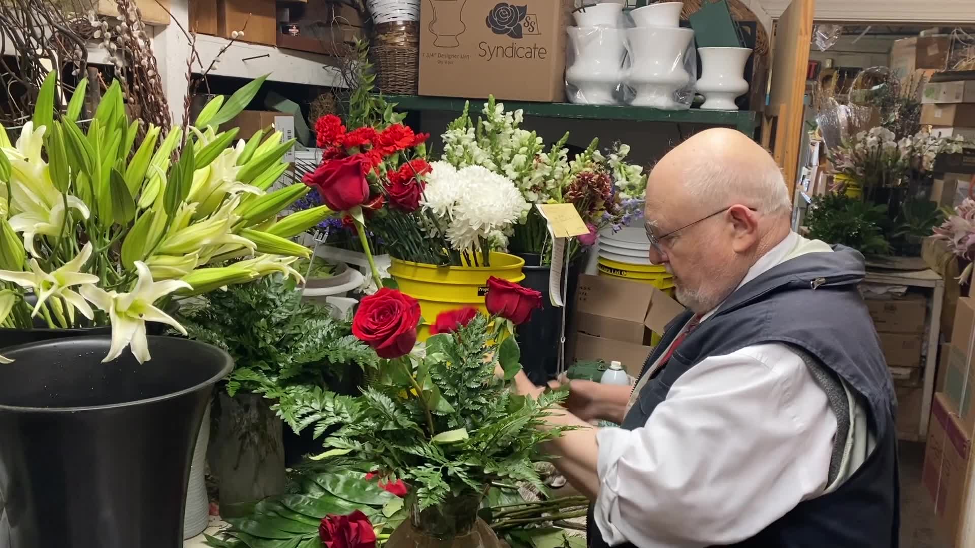 Longtime Virginia Beach florist Wayne Jones creates arrangement